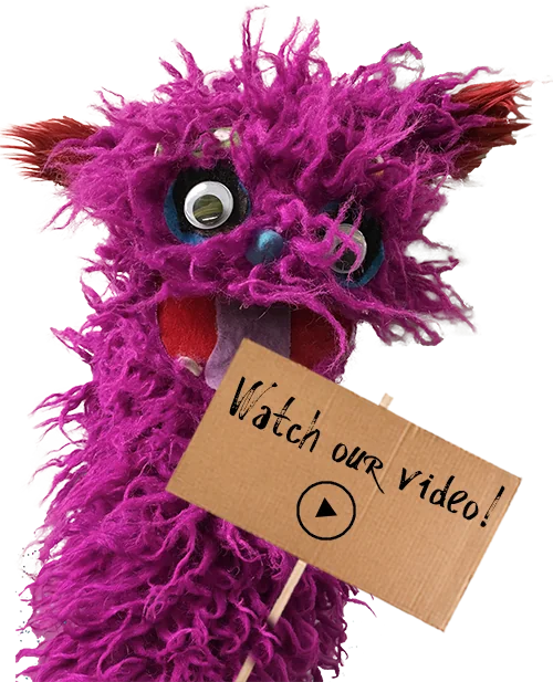 Monster holding a Puppetsburg sign